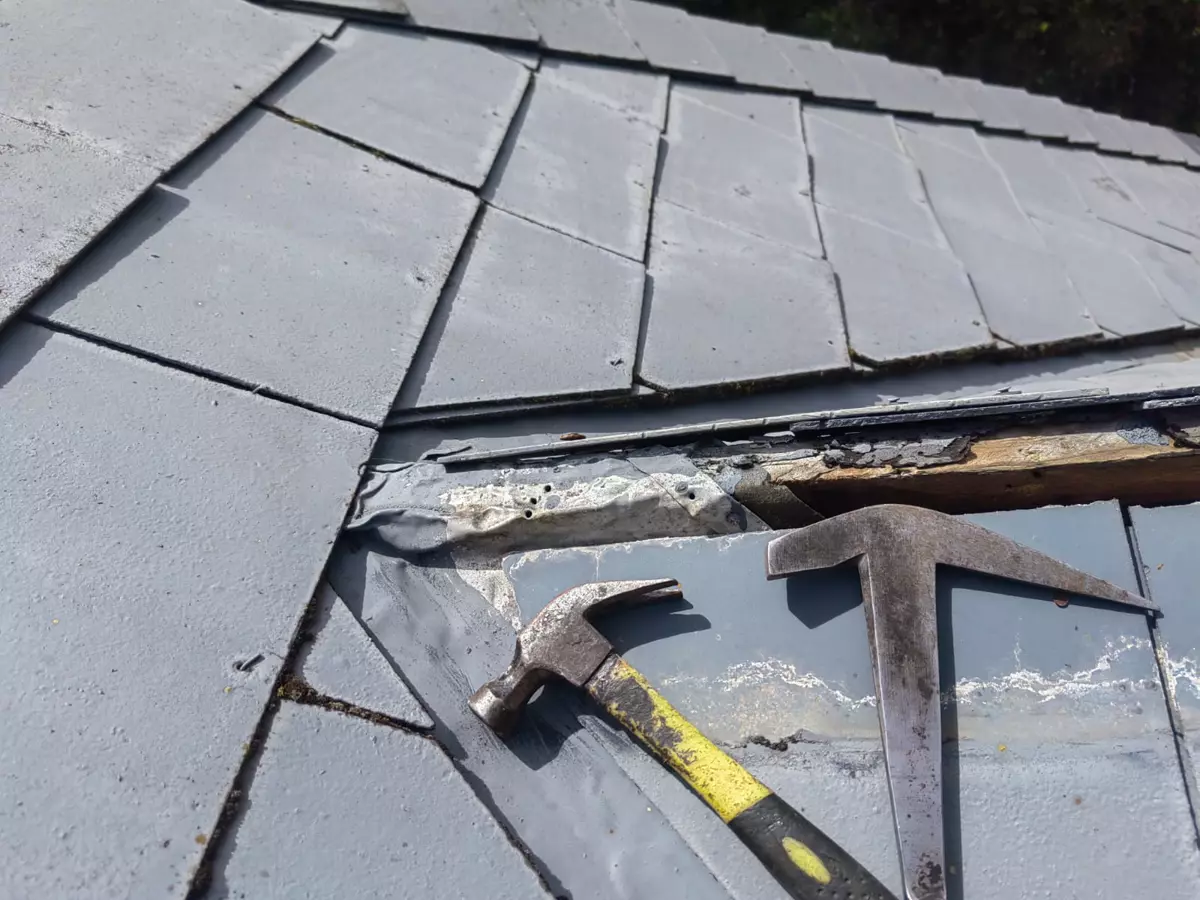 Slate roof repair with roofing tools